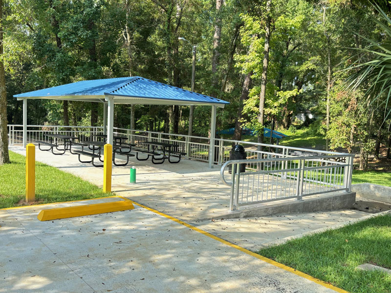 John G. Riley Park shade shelter with bench seating and 2 new parking spots